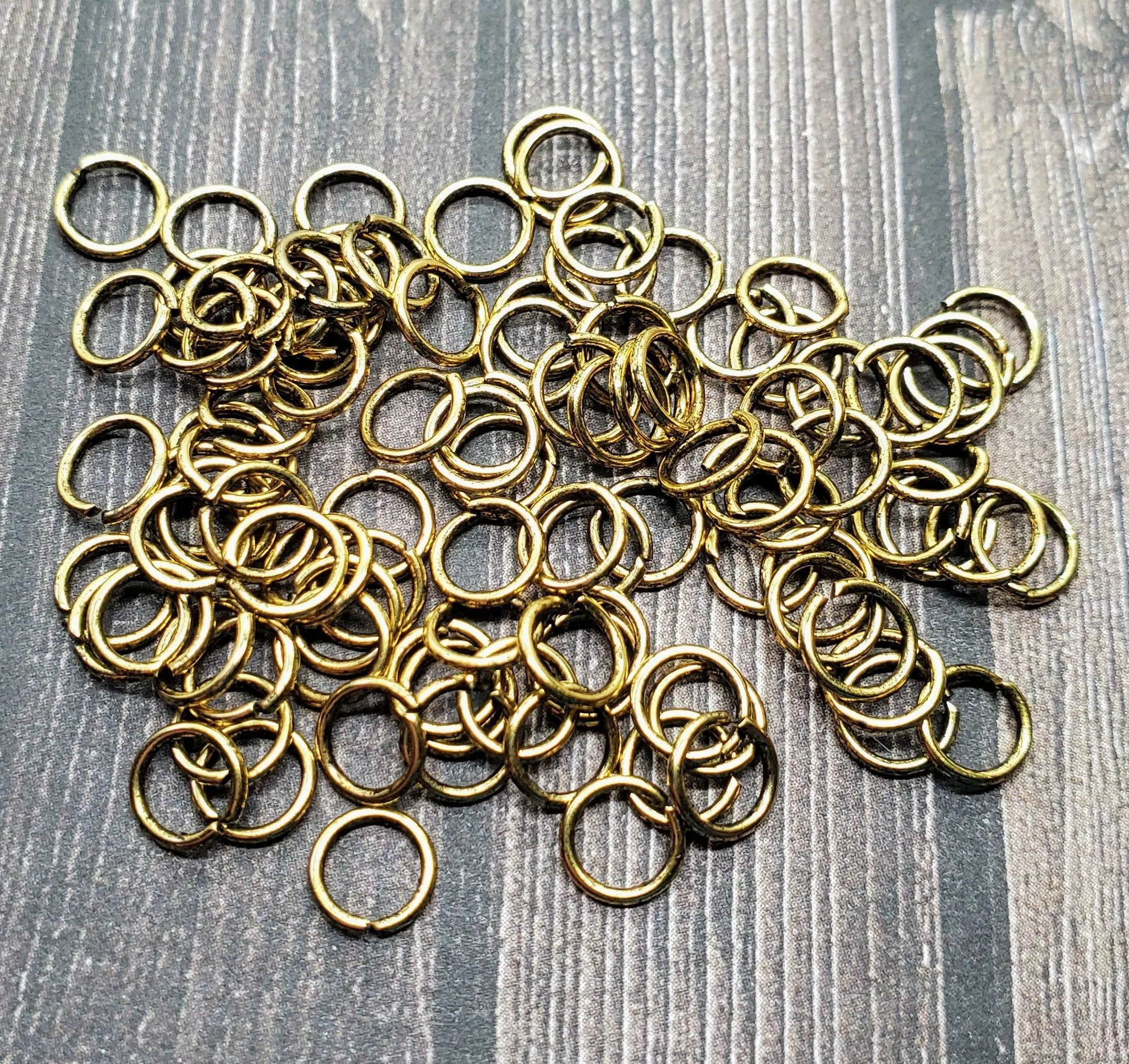 Matte Gold Ox 6mm Open Jump Rings (100) - GOBF14